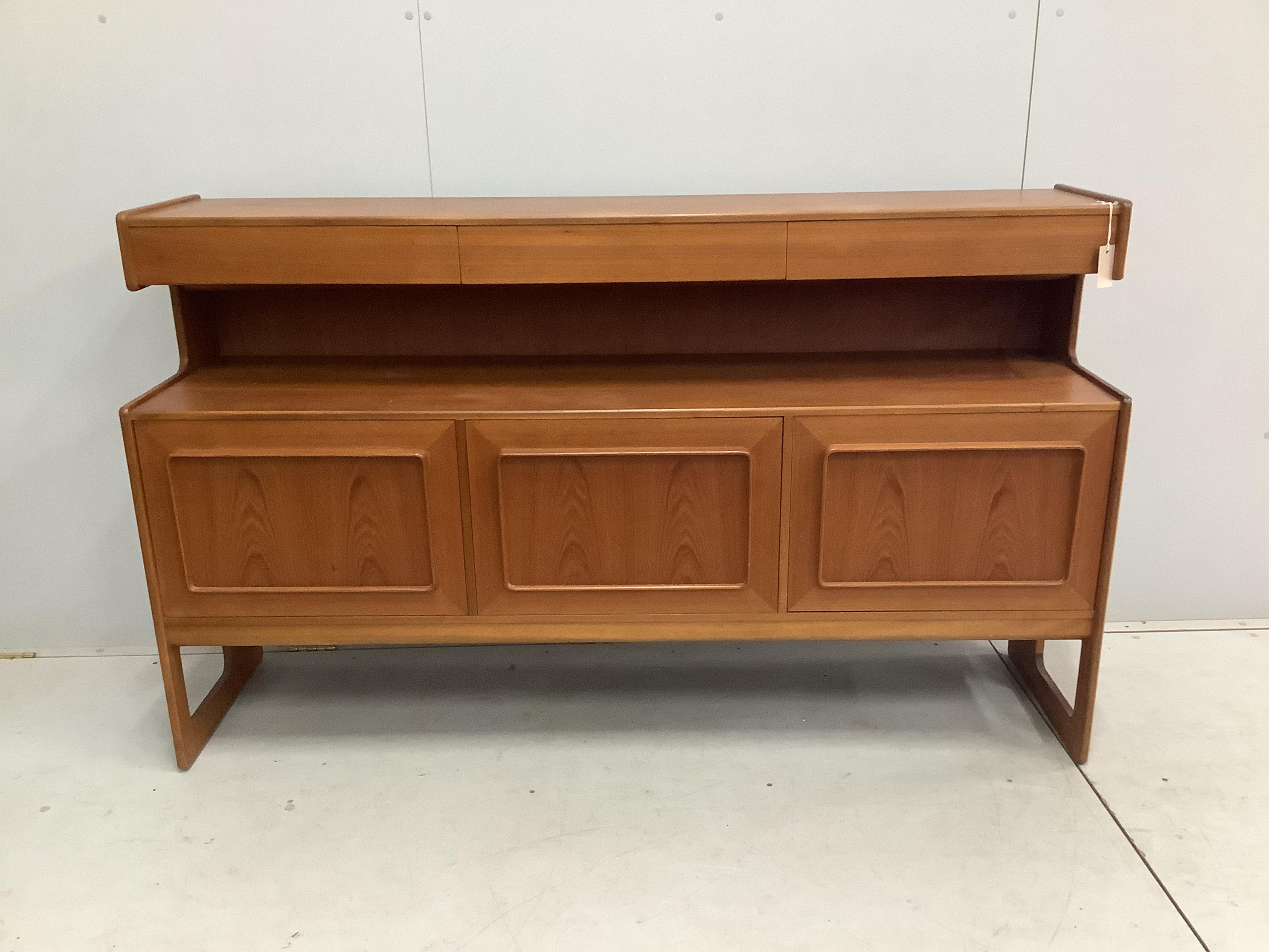 A mid century Danish style MacIntosh Forfar teak sideboard, width 170cm, depth 46cm, height 102cm together with a McIntosh teak extending dining table and four chairs teak sideboard, width 170cm, depth 46cm, height 102cm